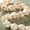12 Packs: 22 ct. (264 total) White Reconstituted Stone Skull Beads, 15mm by Bead Landing™